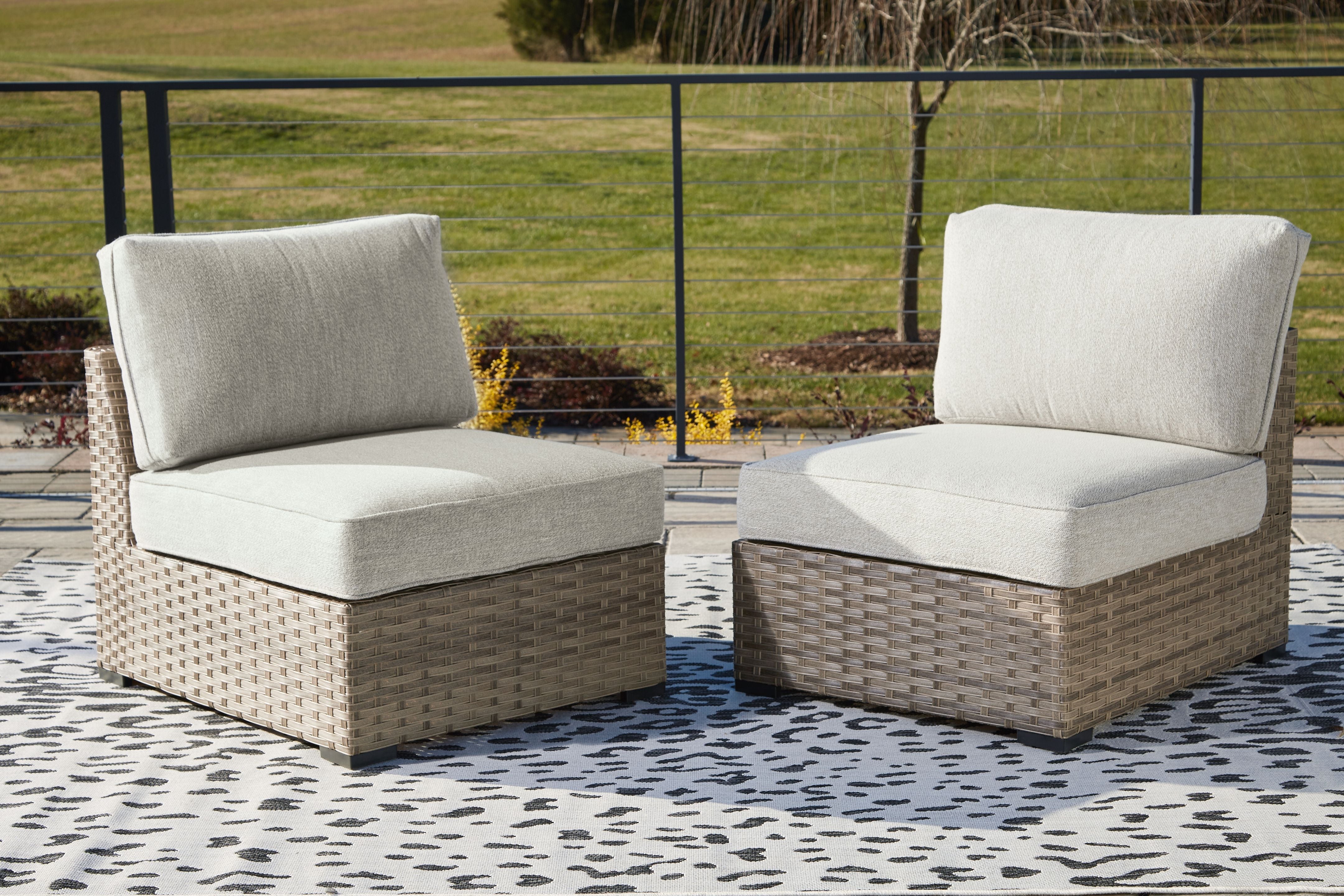 Calworth - Beige - Armless Chair W/Cushion (Set of 2) - Premium Armless Chairs from Ashley Furniture - Just $486.25! Shop now at brett interiors