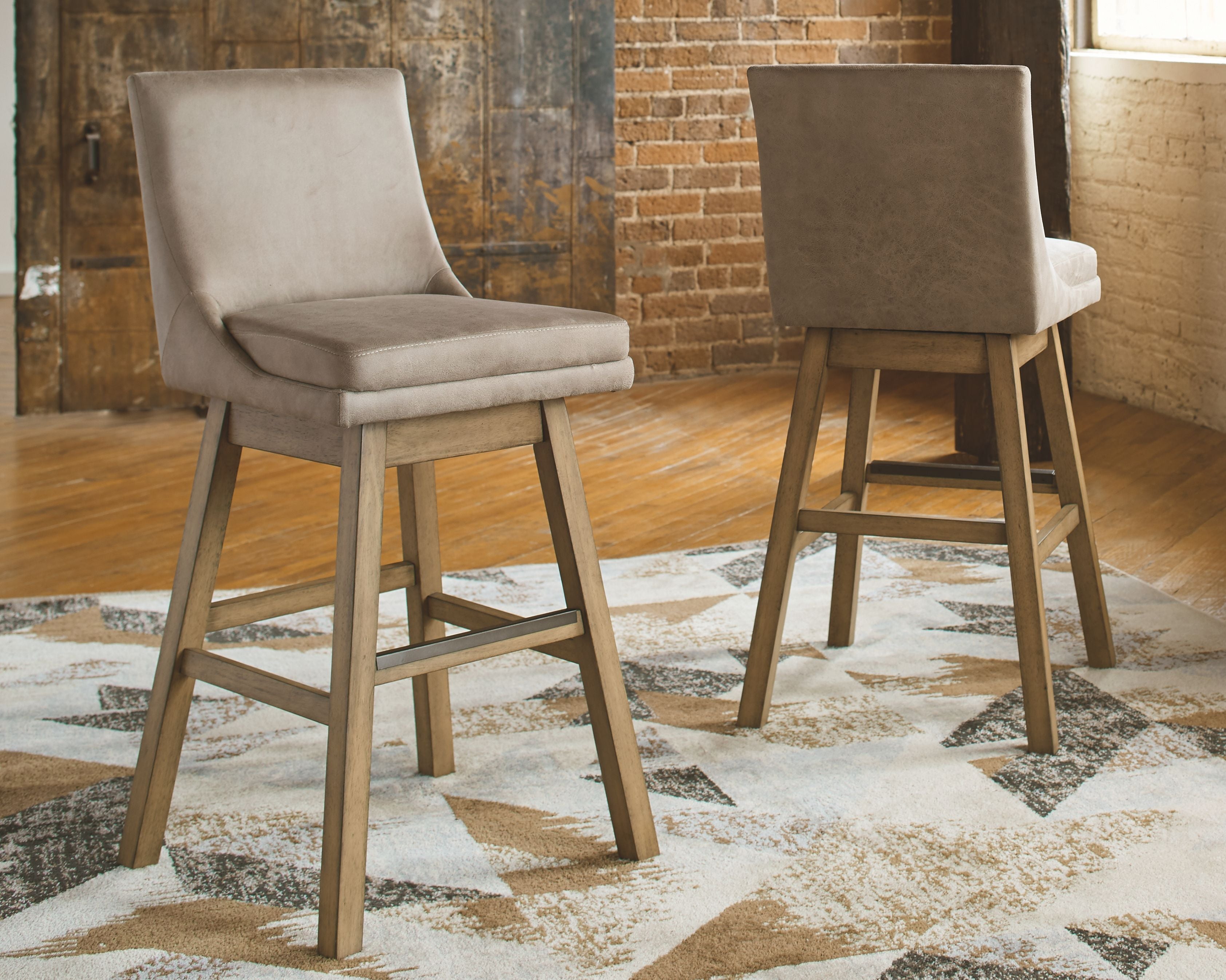 Tallenger - Swivel Barstool (Set of 2) - Premium Stool Sets from Signature Design by Ashley® - Just $444.70! Shop now at brett interiors