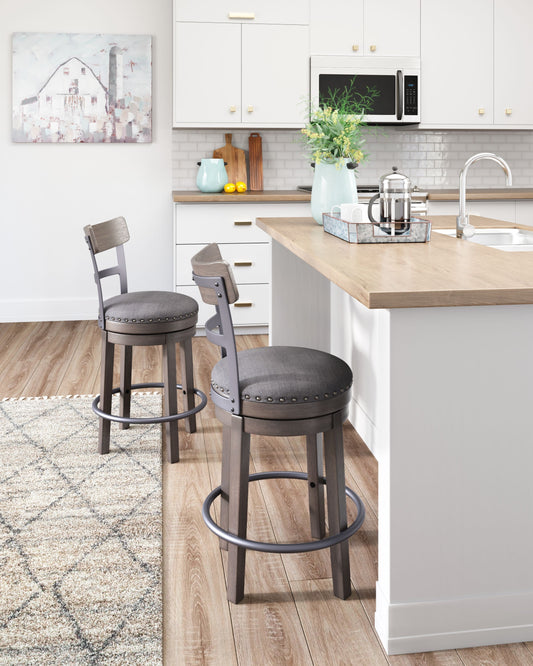 Caitbrook - Gray - Uph Swivel Barstool - Premium Counter Height (24"-27") from Signature Design by Ashley® - Just $236.78! Shop now at brett interiors