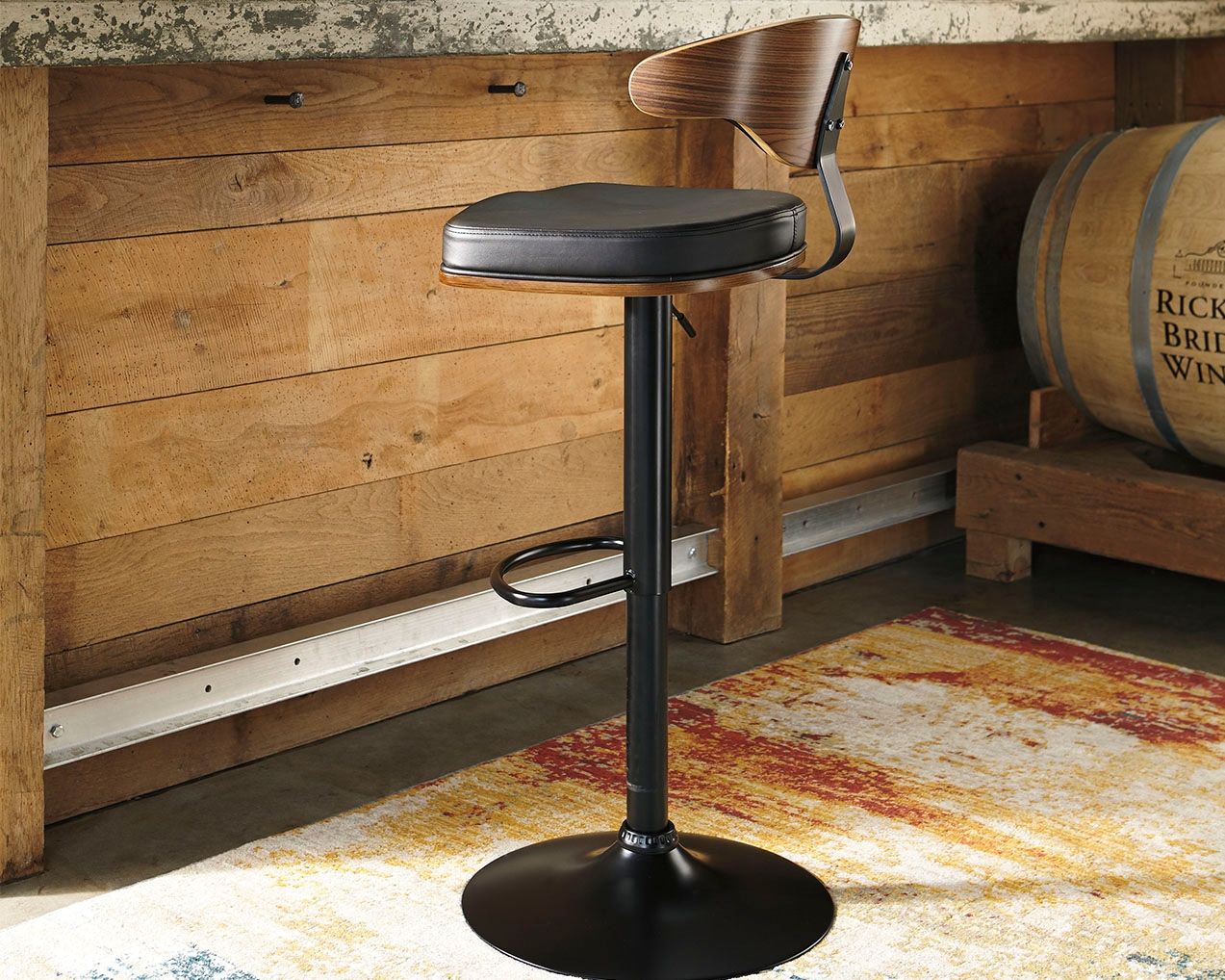 Bellatier - Brown / Black - Tall Uph Swivel Barstool - Premium Adjustable Height from Signature Design by Ashley® - Just $222.35! Shop now at brett interiors