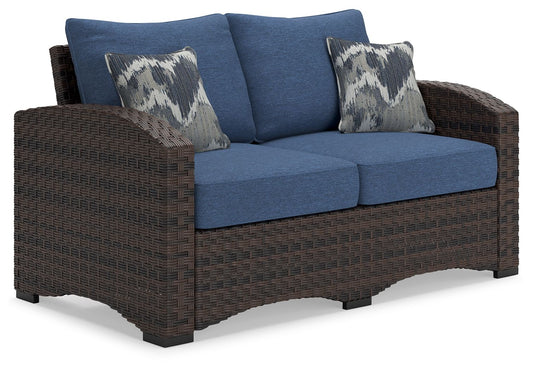 Windglow - Blue / Brown - Loveseat With Cushion - Premium Loveseats from Signature Design by Ashley® - Just $791.25! Shop now at brett interiors