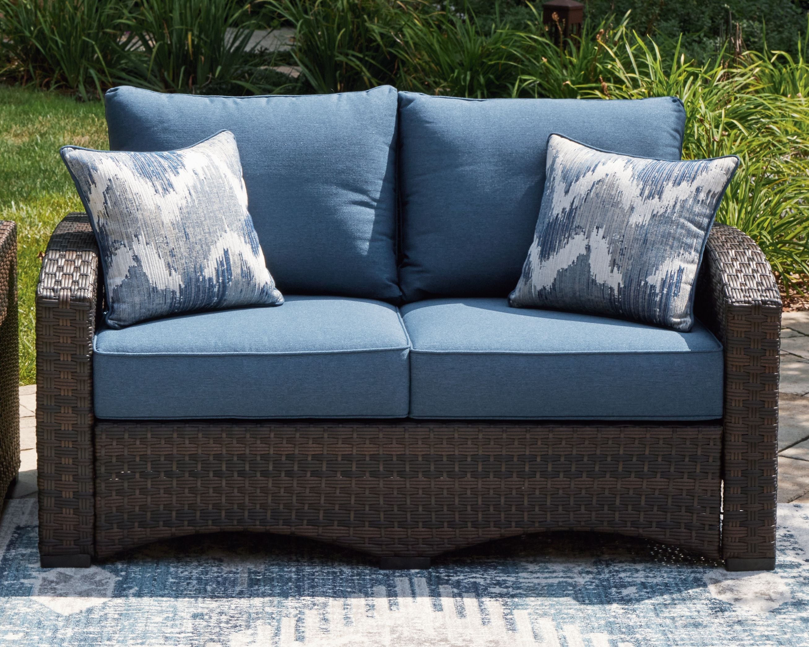 Windglow - Blue / Brown - Loveseat With Cushion - Premium Loveseats from Signature Design by Ashley® - Just $791.25! Shop now at brett interiors