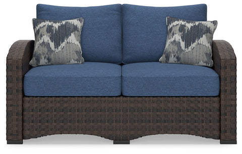 Windglow - Blue / Brown - Loveseat With Cushion - Premium Loveseats from Signature Design by Ashley® - Just $791.25! Shop now at brett interiors