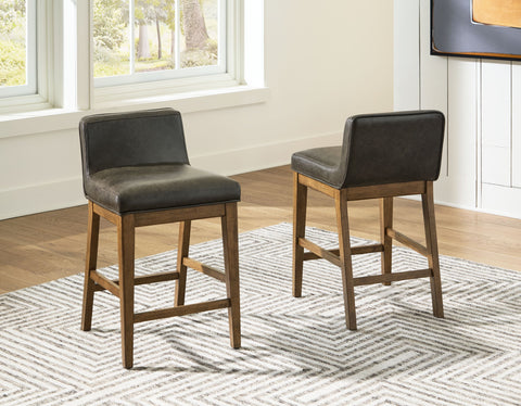 Cabalynn - Two-tone Brown - Upholstered Barstool (Set of 2) - Premium Stool Sets from Signature Design by Ashley® - Just $300.30! Shop now at brett interiors