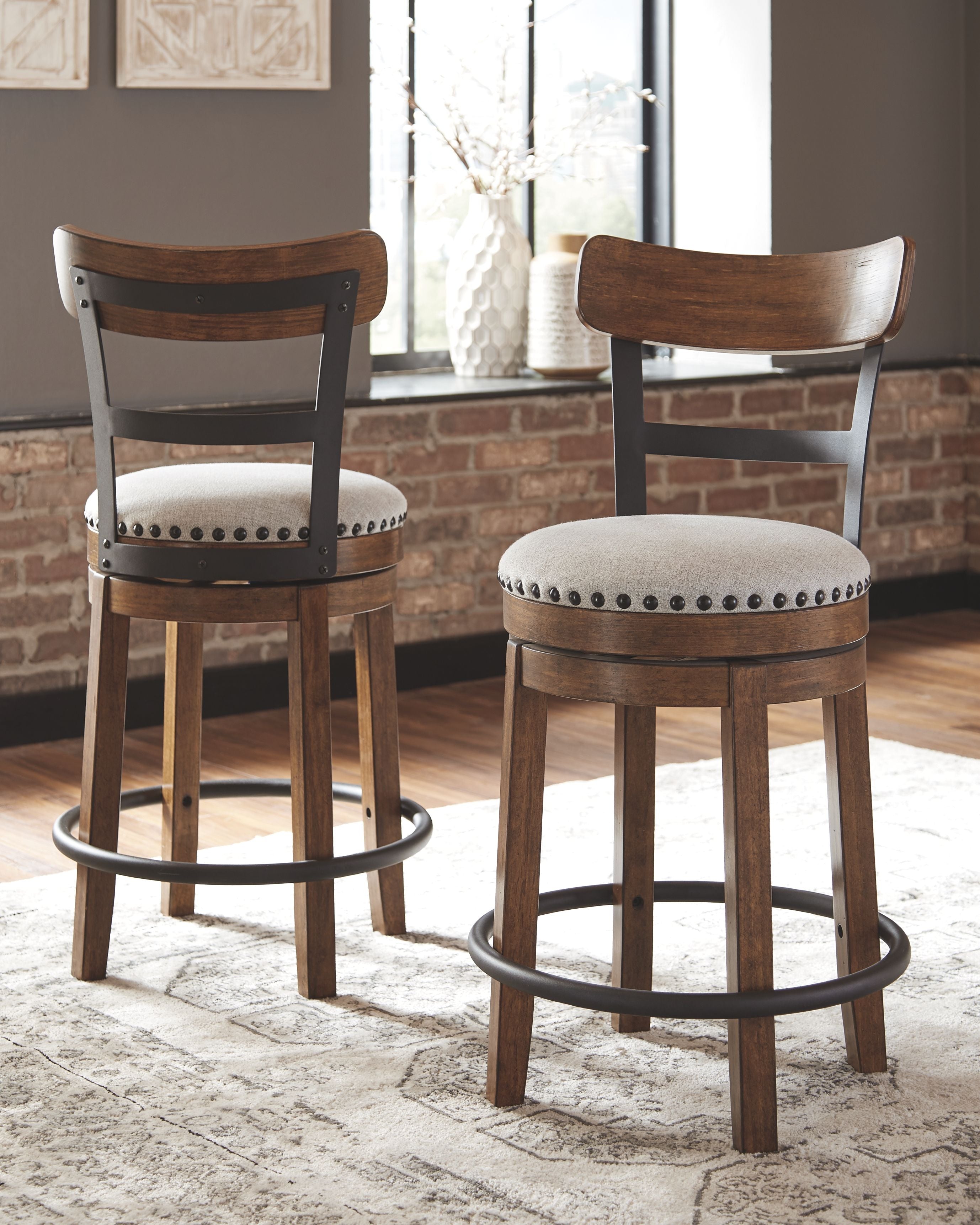 Valebeck - Full Back Swivel Stool - Premium Counter Height (24"-27") from Signature Design by Ashley® - Just $254.10! Shop now at brett interiors