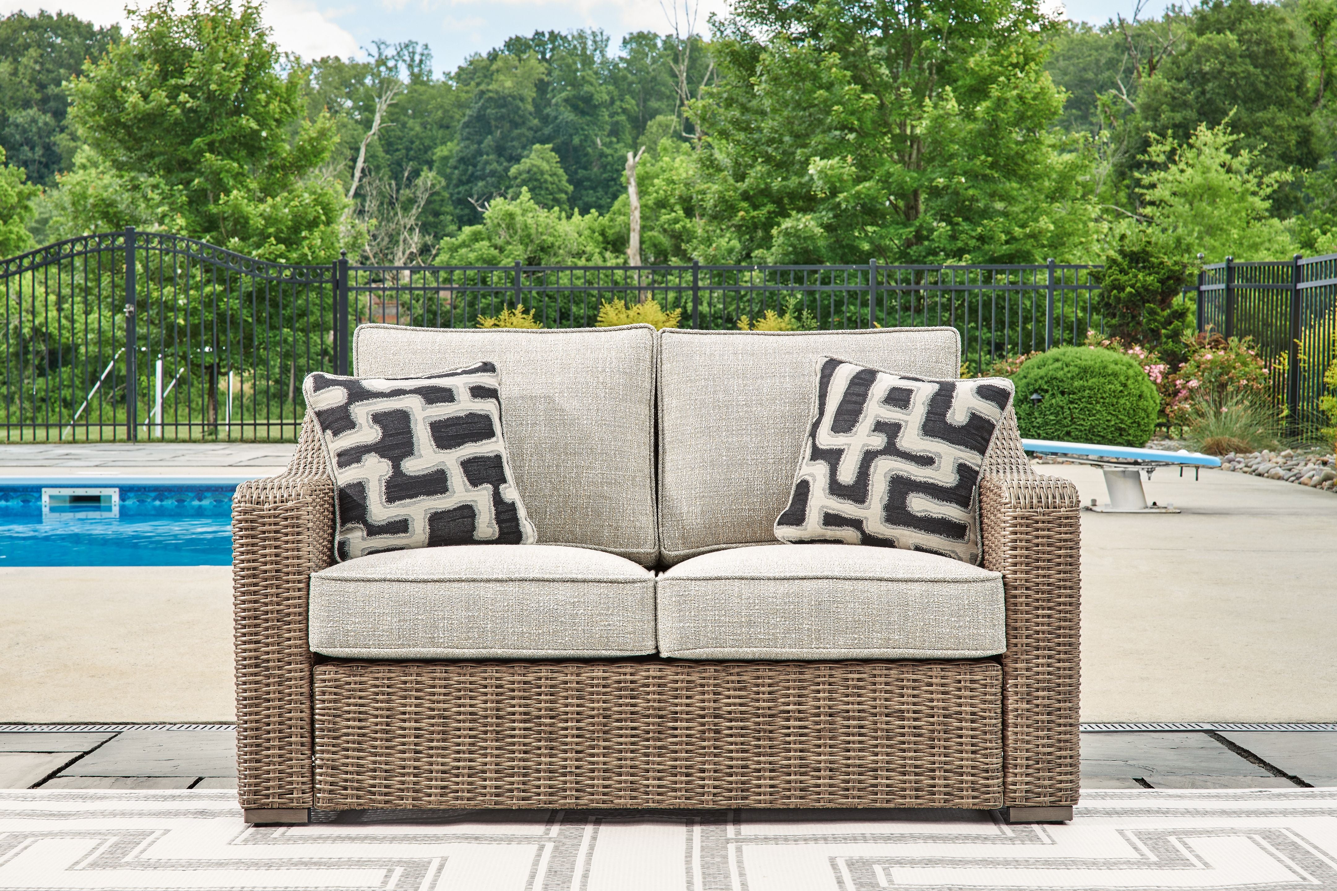 Beachcroft - Beige - Loveseat With Cushion - Premium Loveseats from Signature Design by Ashley® - Just $1371.25! Shop now at brett interiors