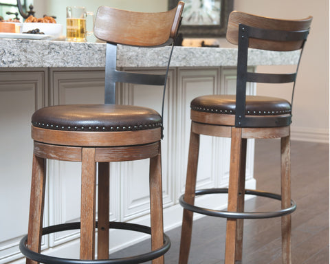 Pinnadel - Swivel Barstool - Premium Counter Height (24"-27") from Ashley Furniture - Just $254.10! Shop now at brett interiors