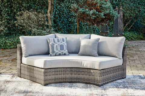 Harbor Court - Gray - Curved Loveseat With Cushion - Premium Loveseats from Signature Design by Ashley® - Just $1036.25! Shop now at brett interiors